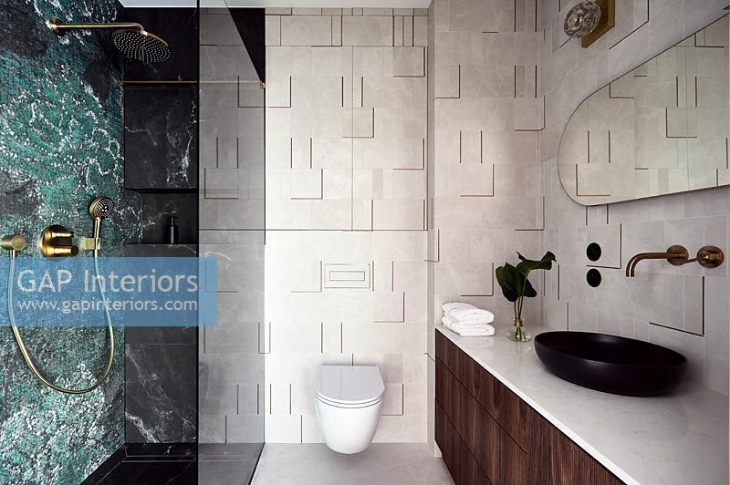 Modern bathroom with textured tiling on wall