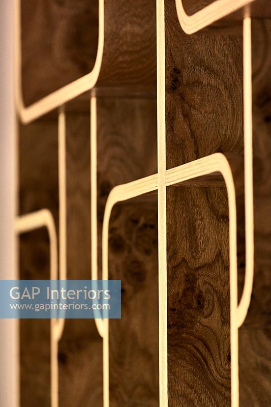 Golden pattern on wooden wall detail 