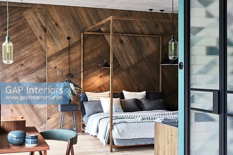 Modern bedroom with wooden wall