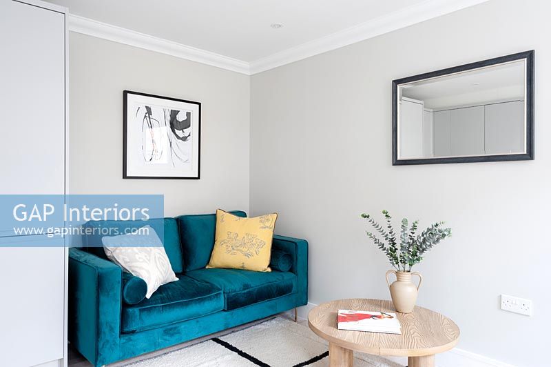 Blue velvet sofa in small modern living room 