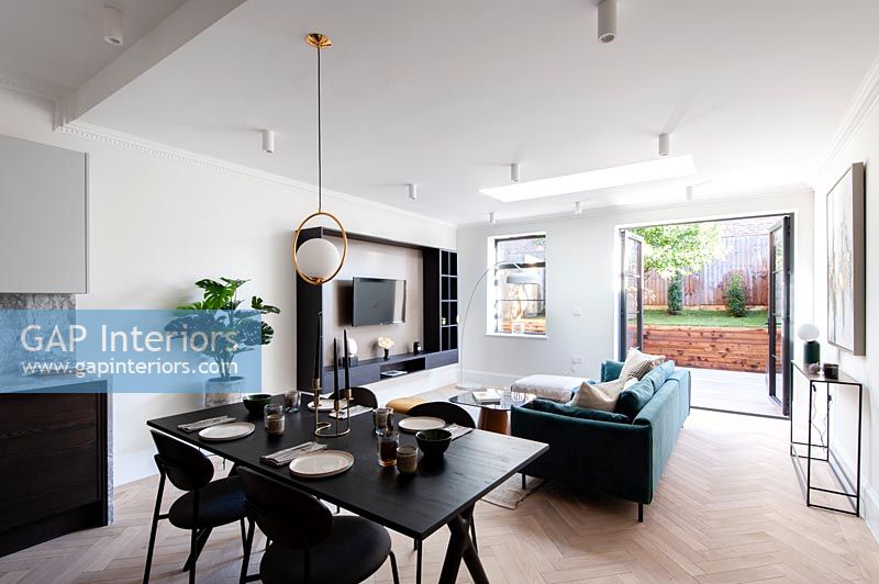 Modern open plan living space with dining area 
