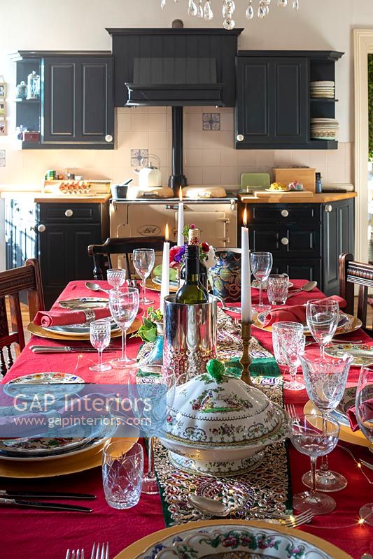 Country kitchen-diner - dining table laid for Christmas dinner 