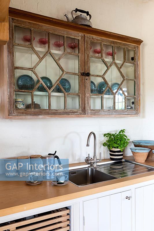 Decorative wooden wall mounted cabinet in country kitchen