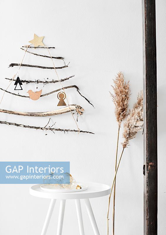 Wall mounted Christmas tree decoration made from twigs
