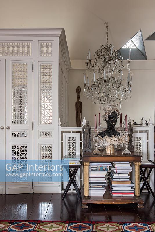 Decorative white doors in eclectic living room 