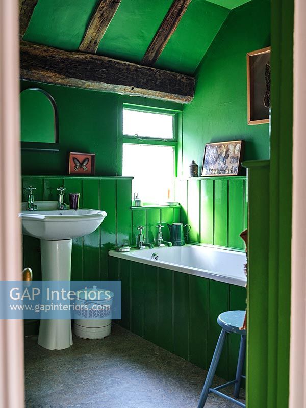 Bright green painted country bathroom 