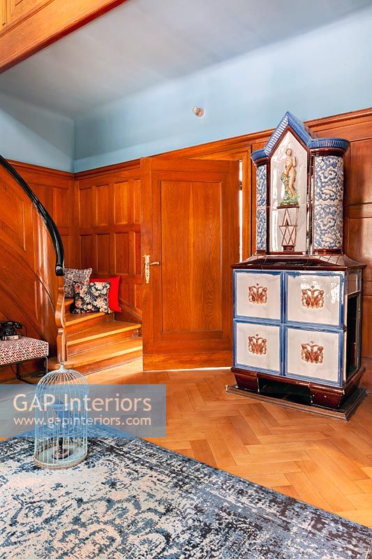 Classic wooden staircase - unusual antique cabinet in hallway 