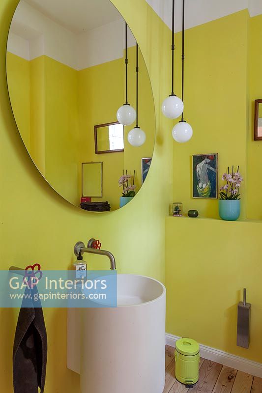 Bright yellow painted modern bathroom 