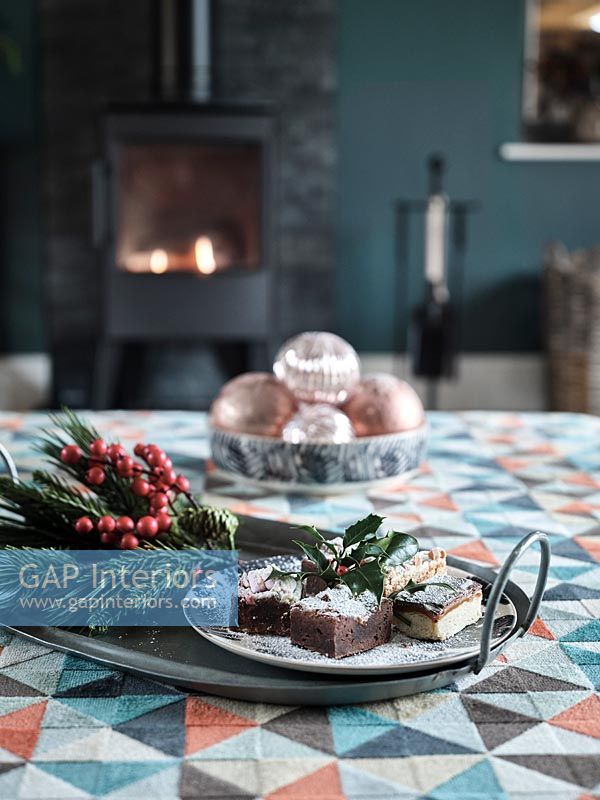 Cake and natural decorations on living room footstool for Christmas 