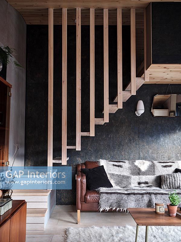 Floating wooden staircase in modern living room 
