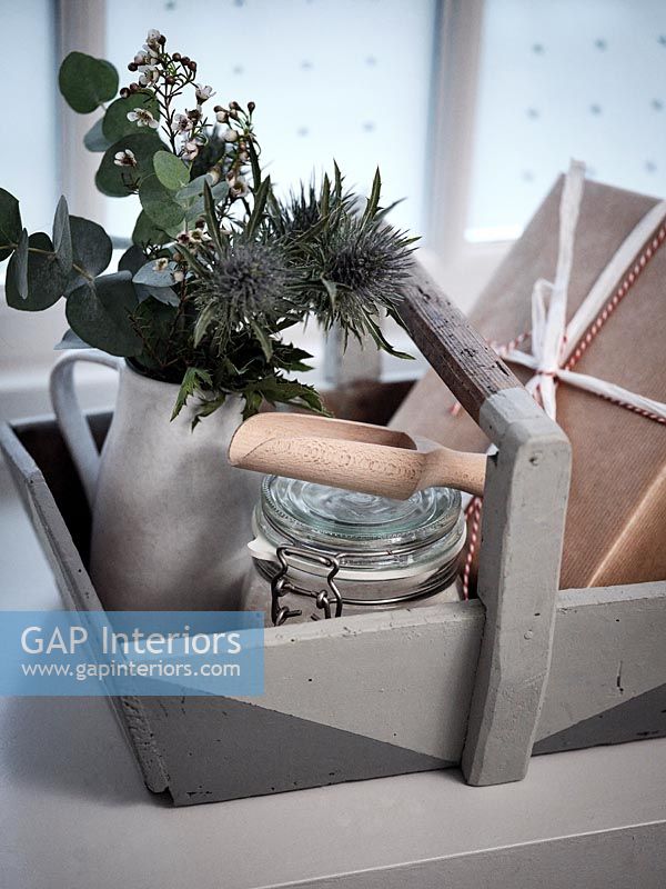 Grey painted wooden trug with flower arrangement and gift - detail 