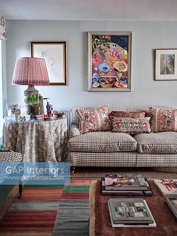 Country living room with mix of patterned fabrics 