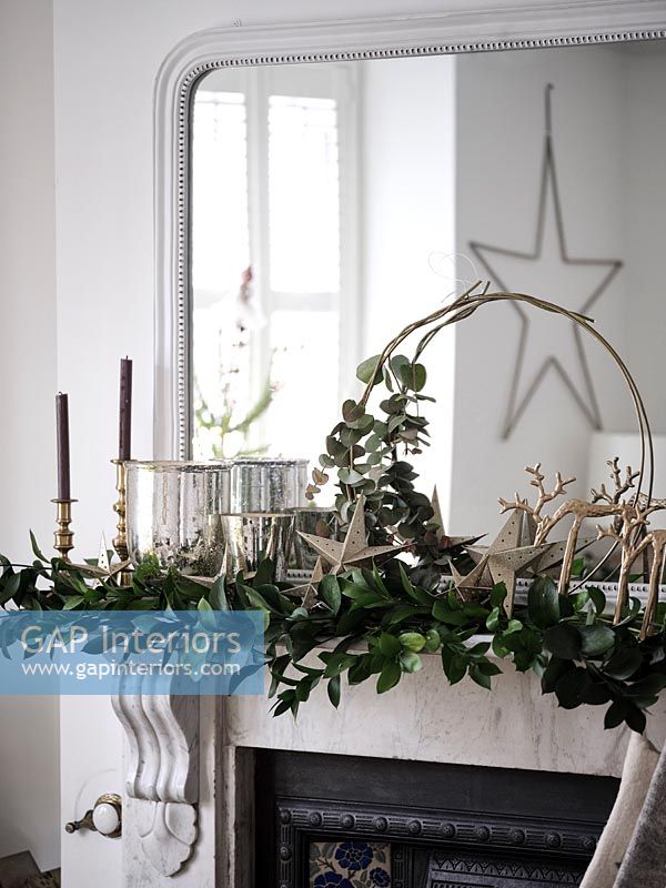 Christmas garland on modern mantelpiece 