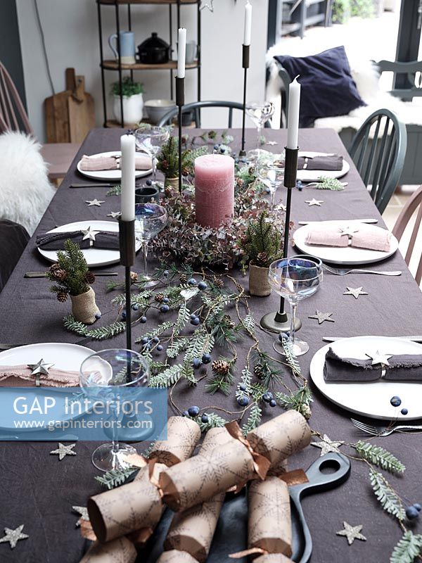 Detail of modern dining table decorated for Christmas 
