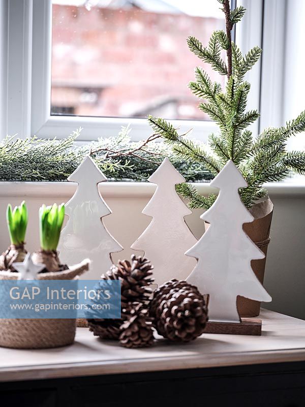 Detail of modern Christmas decorations and pinecones 