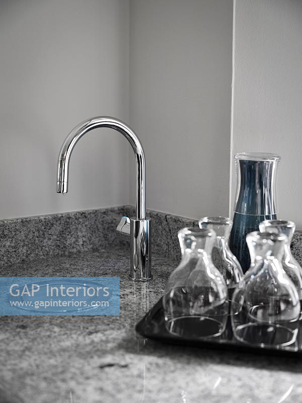Drinking water tap in corner of modern kitchen worktop 