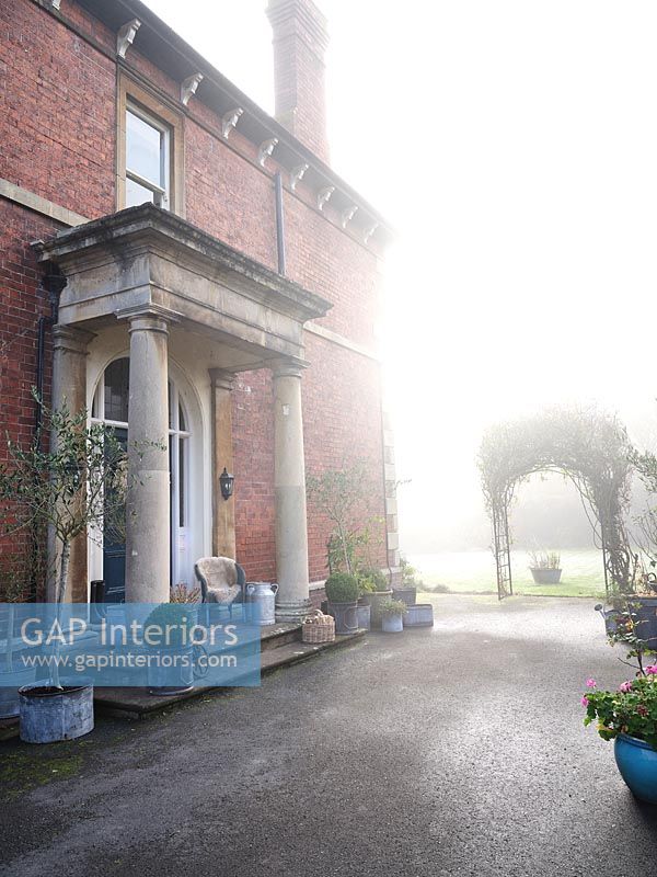 Country house exterior in hazy sunshine 