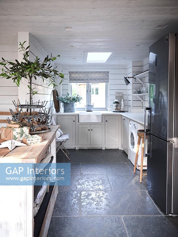 Modern kitchen with Christmas gifts on island worktop 