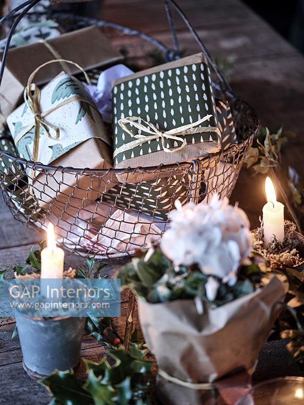 Wire basket filled with Christmas gifts