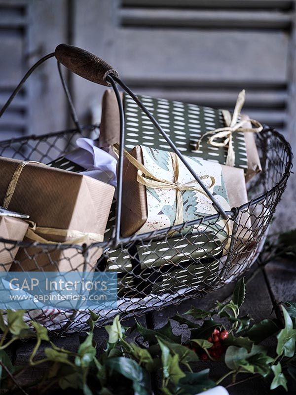 Wire basket filled with Christmas gifts