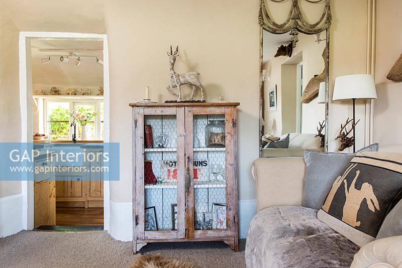 Distressed wooden unit in modern country living room
