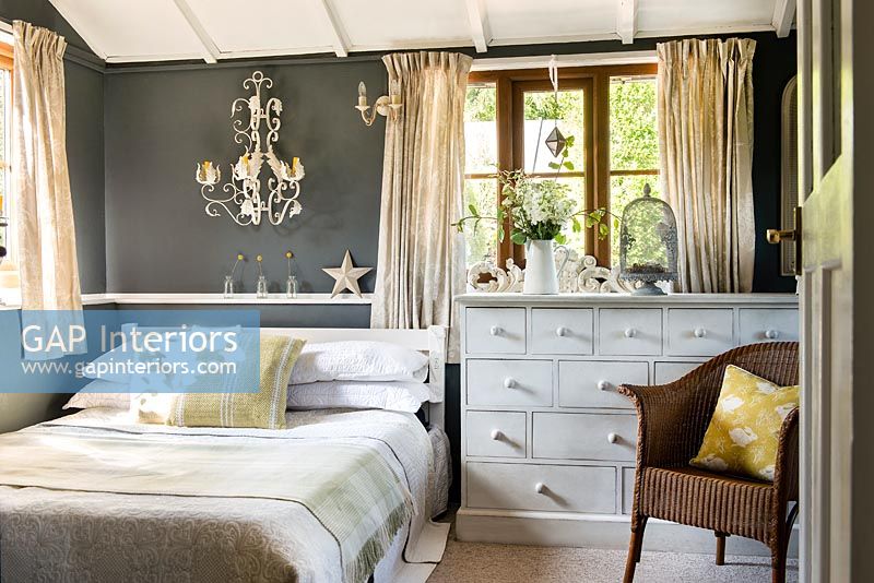 Grey painted wall in modern country bedroom 