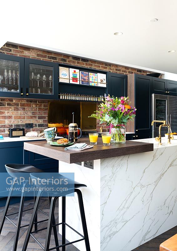 Exposed brick wall in modern kitchen 
