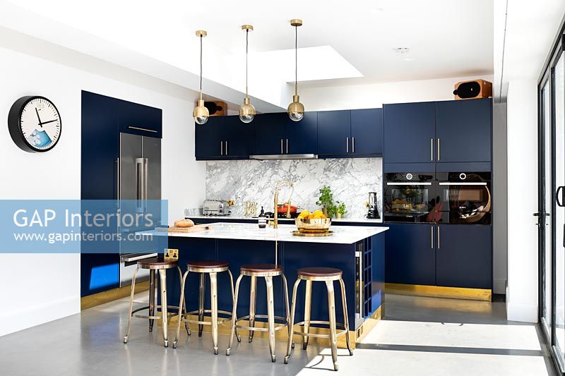 Navy blue kitchen with gold trim