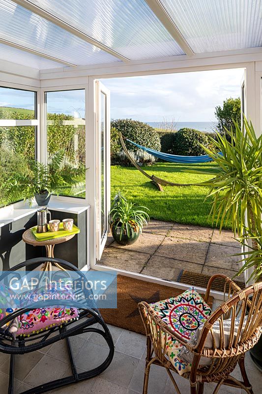 UPVC conservatory with garden and view of the sea