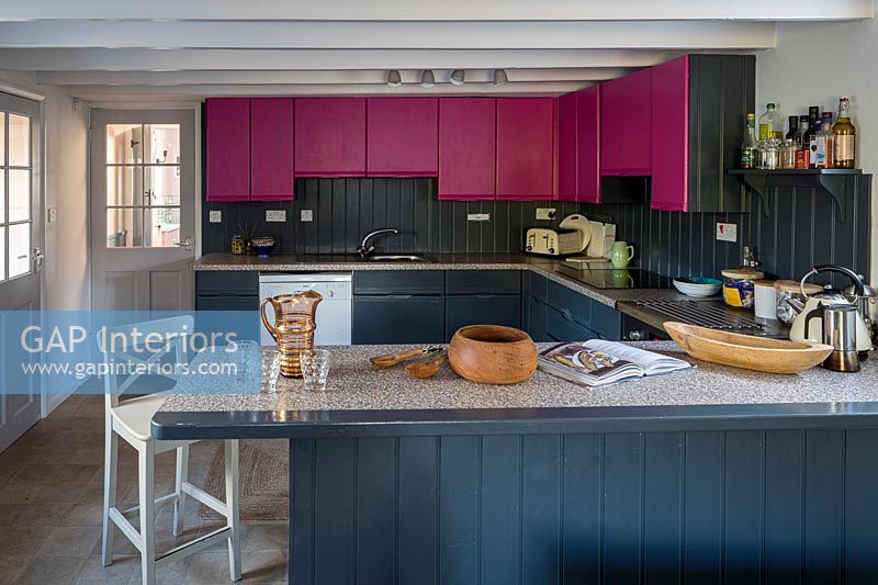 Colourful modern kitchen in small country cottage 