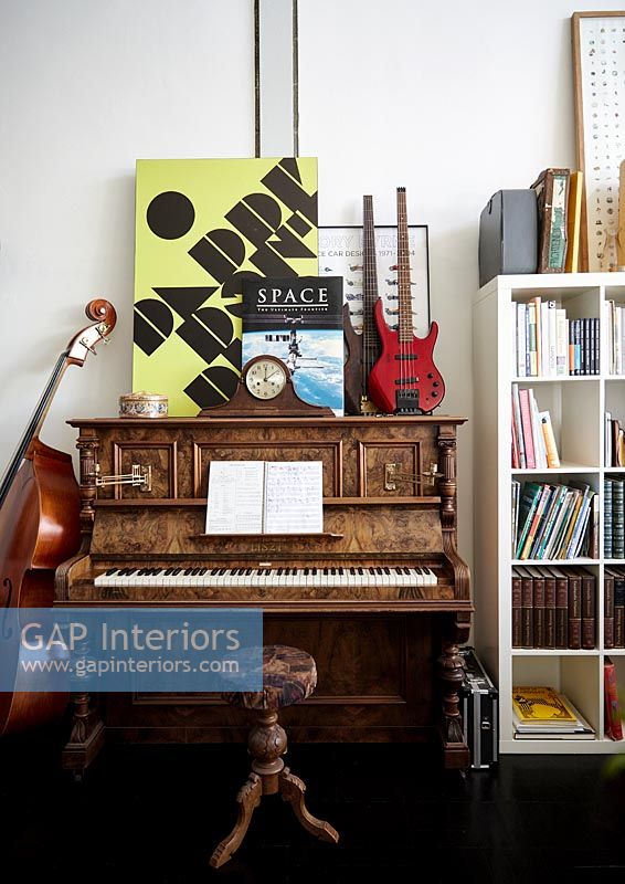Piano with string instruments and retro artwork