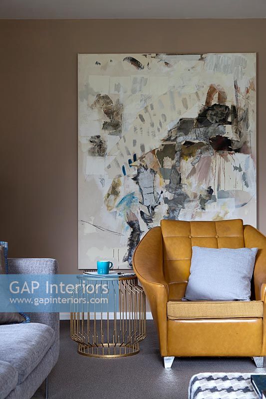Vintage leather armchair in modern living room 