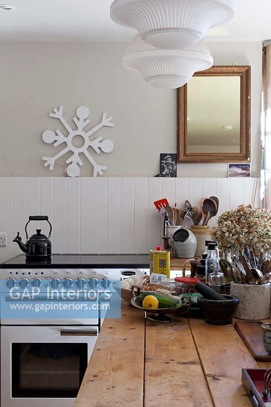 Carved snowflake ornament on wall of modern country kitchen 