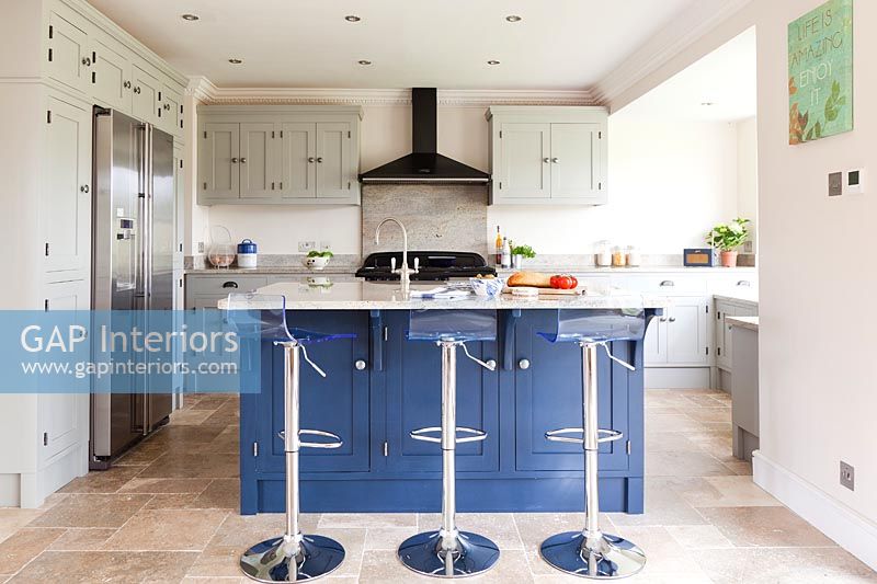 Dark blue island in modern kitchen 