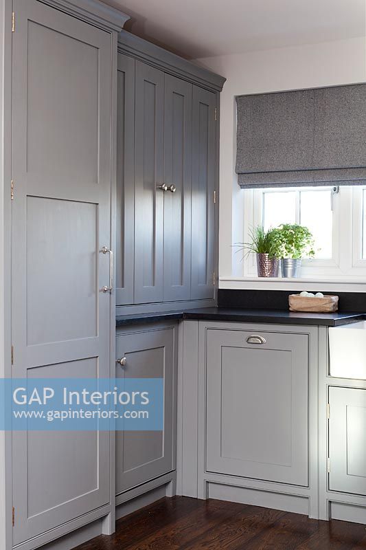 Modern kitchen cabinets painted in different shades of grey 
