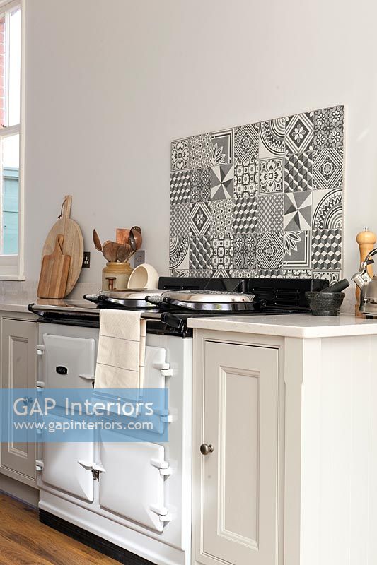 White AGA cooker with patterned tiling
