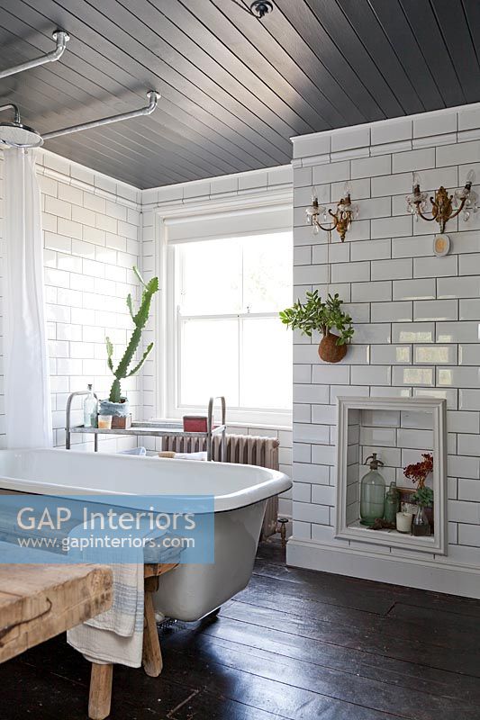 Modern bathroom with wall mounted plant pot and lights 