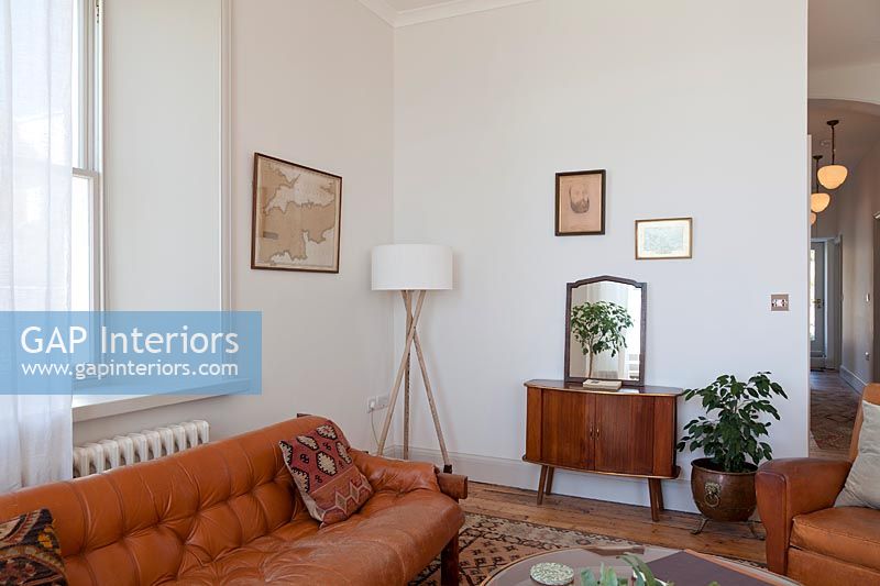 Vintage brown leather furniture in simple living room 