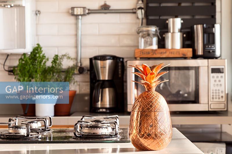 Copper pineapple on kitchen worktop