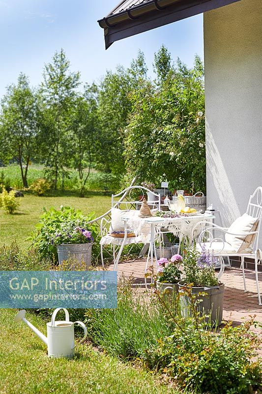 White furniture in country garden 