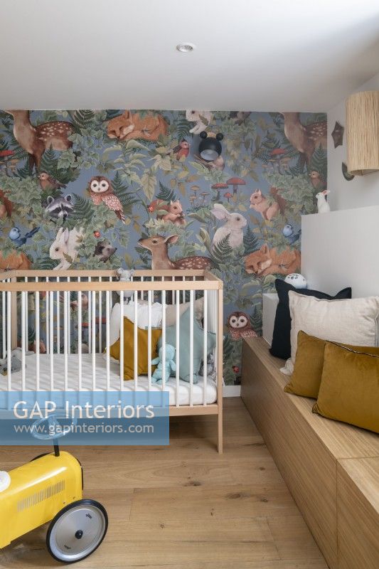 Small childres room with animal print wallpaper