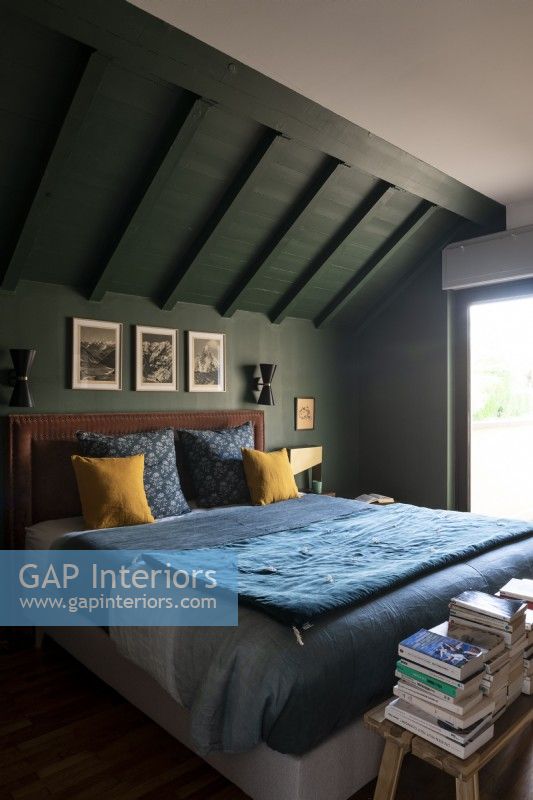  cosy master bedroom painted in green
