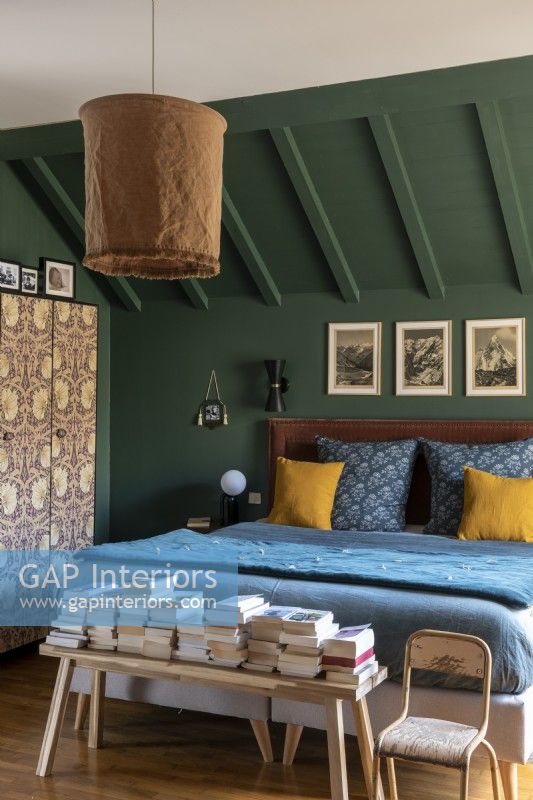 Cosy bedroom painted in green