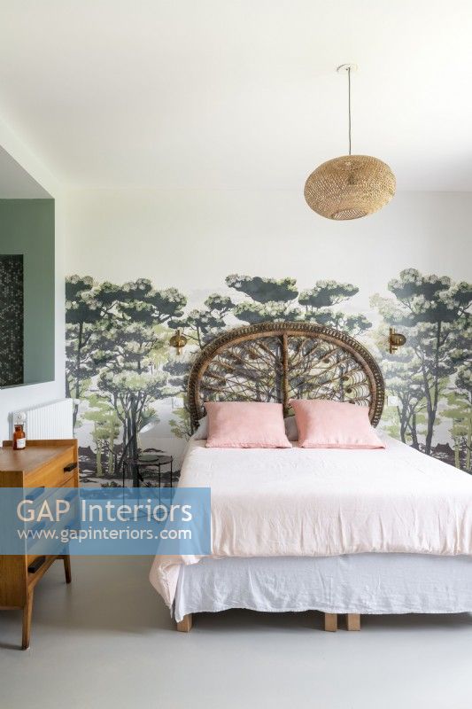 Mural of trees on feature wall in modern country bedroom 