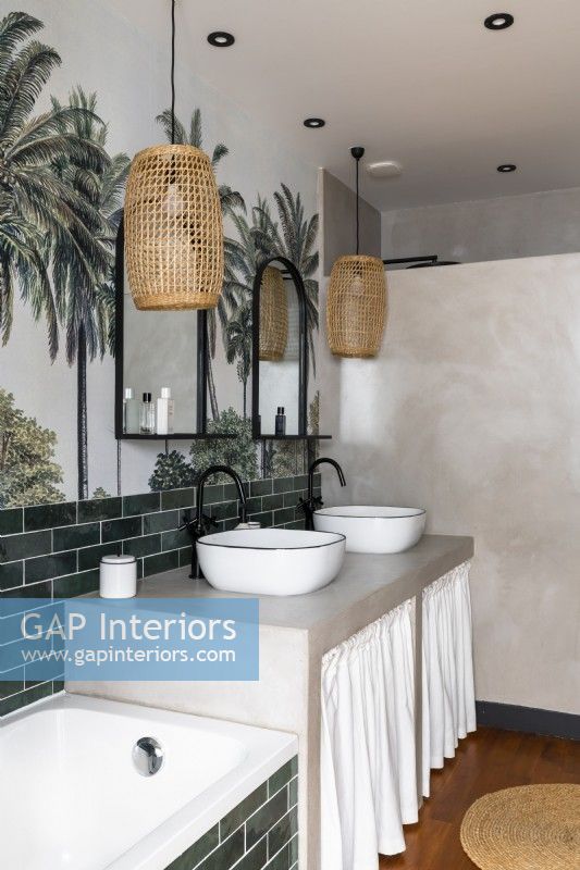 Skirts under twin sinks in modern bathroom with tropical wall mural