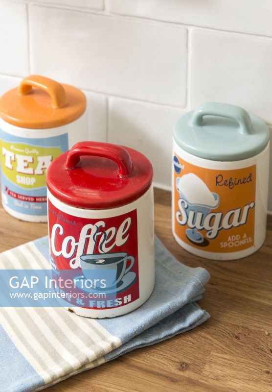 Retro style tea, coffee and sugar storage jars in kitchen - detail