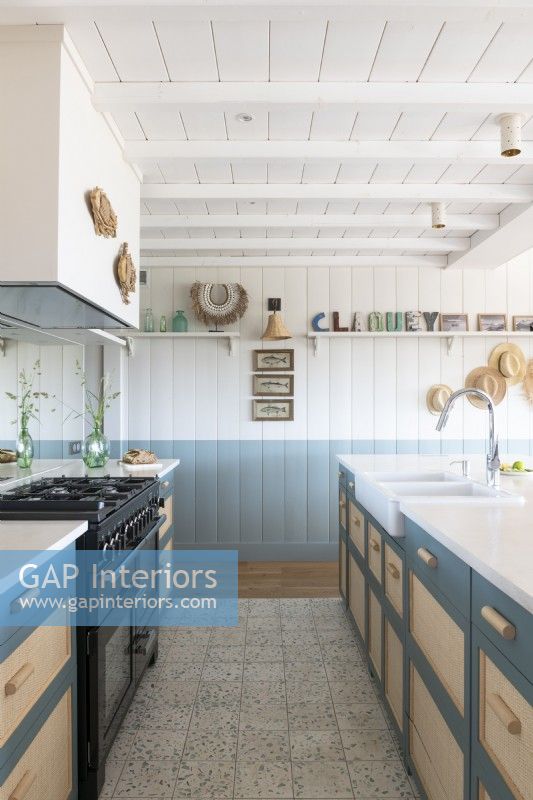 Blue and white country style kitchen in coastal cabin