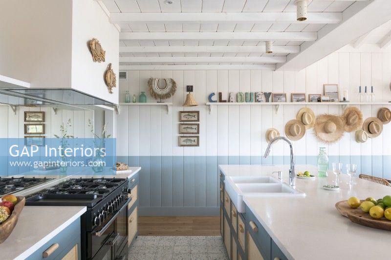 Blue and white country style kitchen in coastal cabin