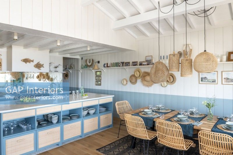 Blue and white kitchen-diner in cabin home 