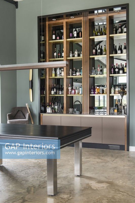Drinks cabinet - unit in modern living room with concrete flooring